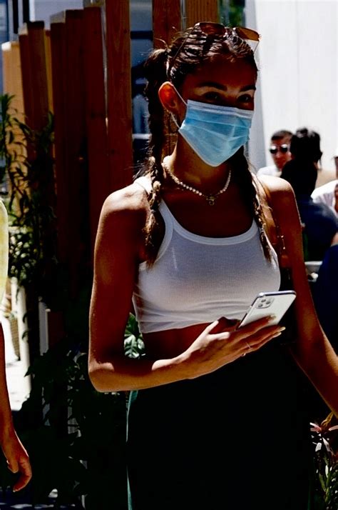 Madison Beer slightly nude pictures from a photoshoot for her new album 'Life Support. Madison Beer in a surgical mask and yellow bikini top as she grabs some lunch to go at Cafe Havana in Malibu. Madison Beer shared a few selfie photos posing in a green top without a bra.